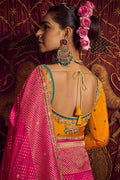 Rani Pink Patola Banarasi Saree with Golden Zari Weave – Bridal & Festive Wear VA